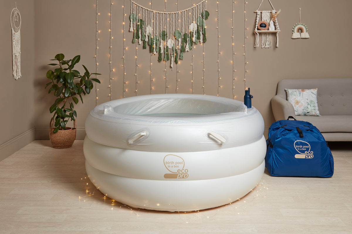 White birthpool with accessories and setup items